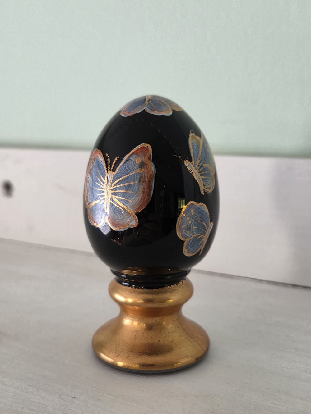 Hand-Painted Black Butterfly Decorative Egg with Gold Stand
